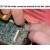 25. Pull the white connector towards to the flex cable